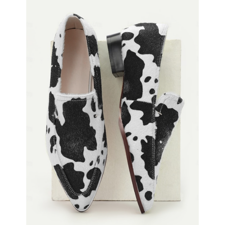 Margot | Elegante Slipper mit auffälligem Kuhfleckenmuster